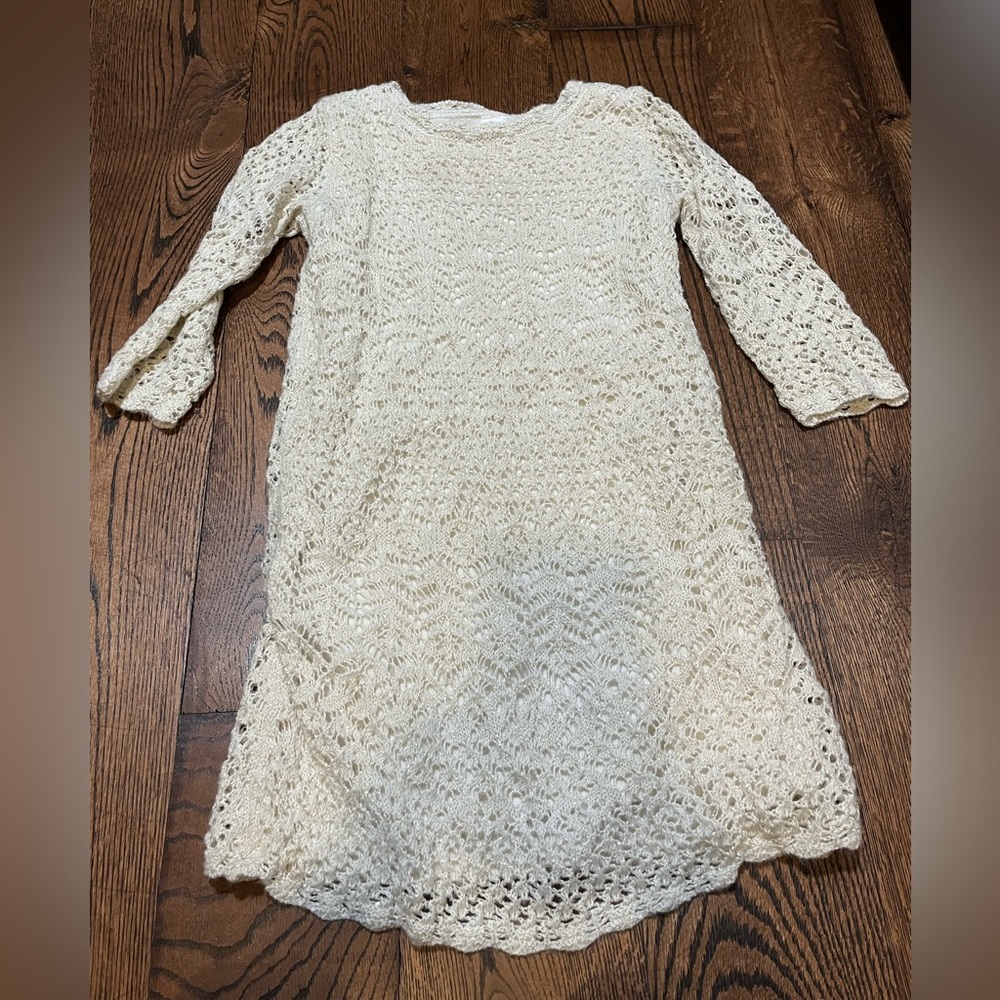 A white formal dress with see-through arms